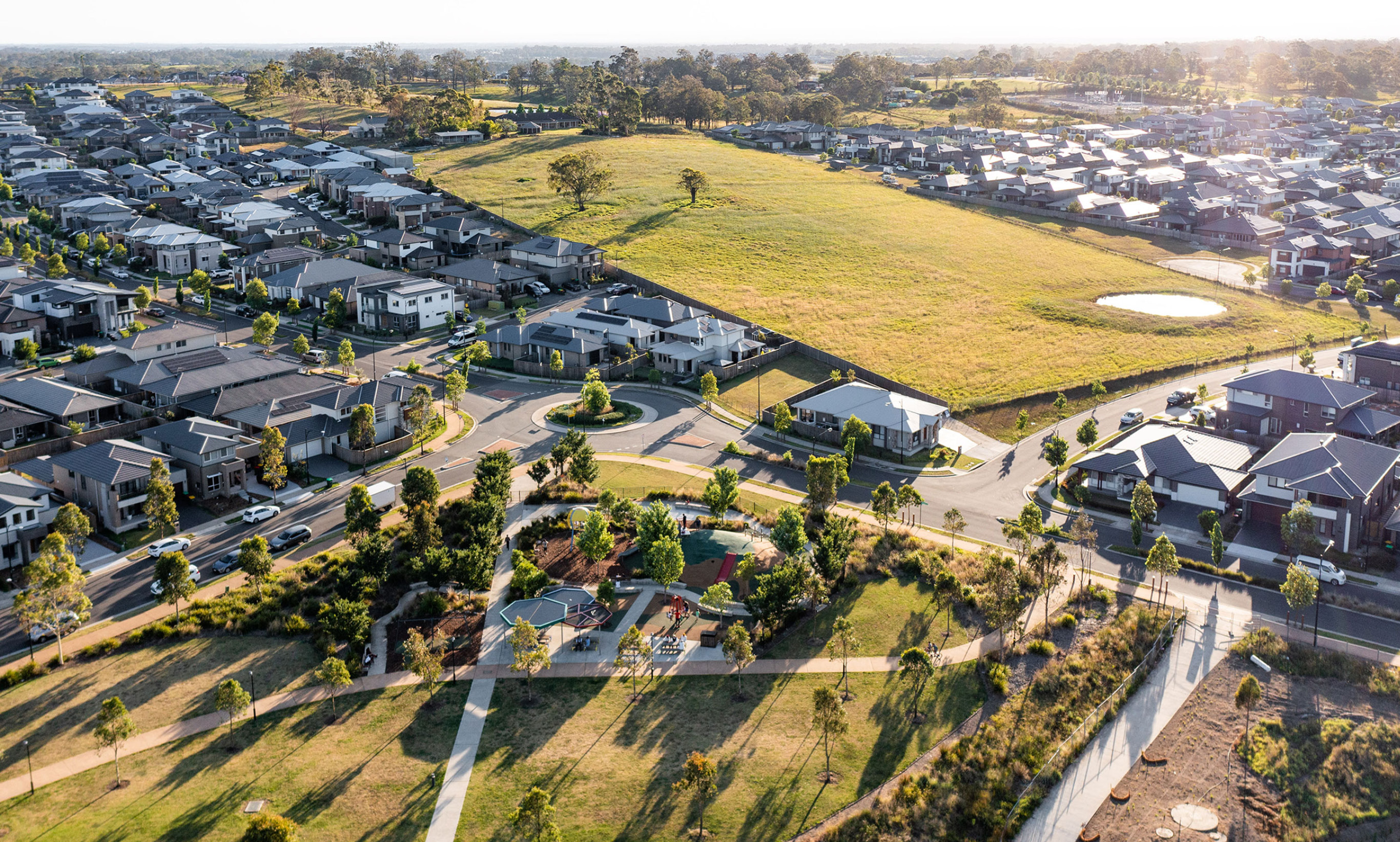 overview of The Gables estate within Box Hill, NSW. Rolling hills, playgrounds and homes