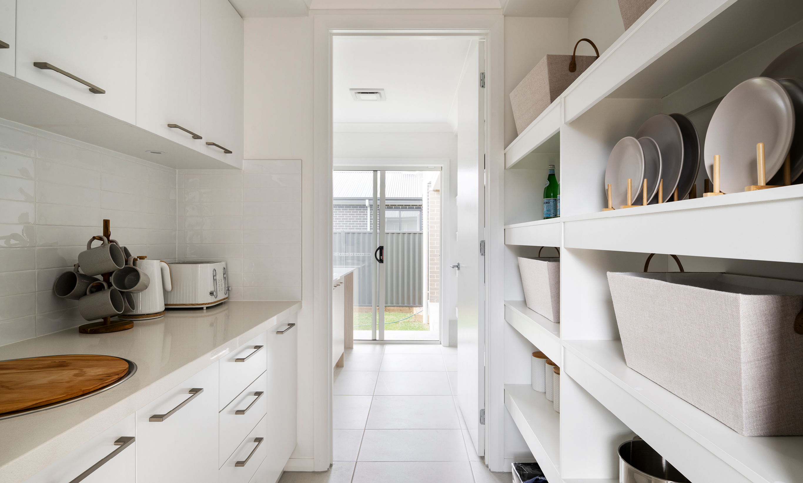 butler's pantry with drink station including kettle and bugs next to taster.